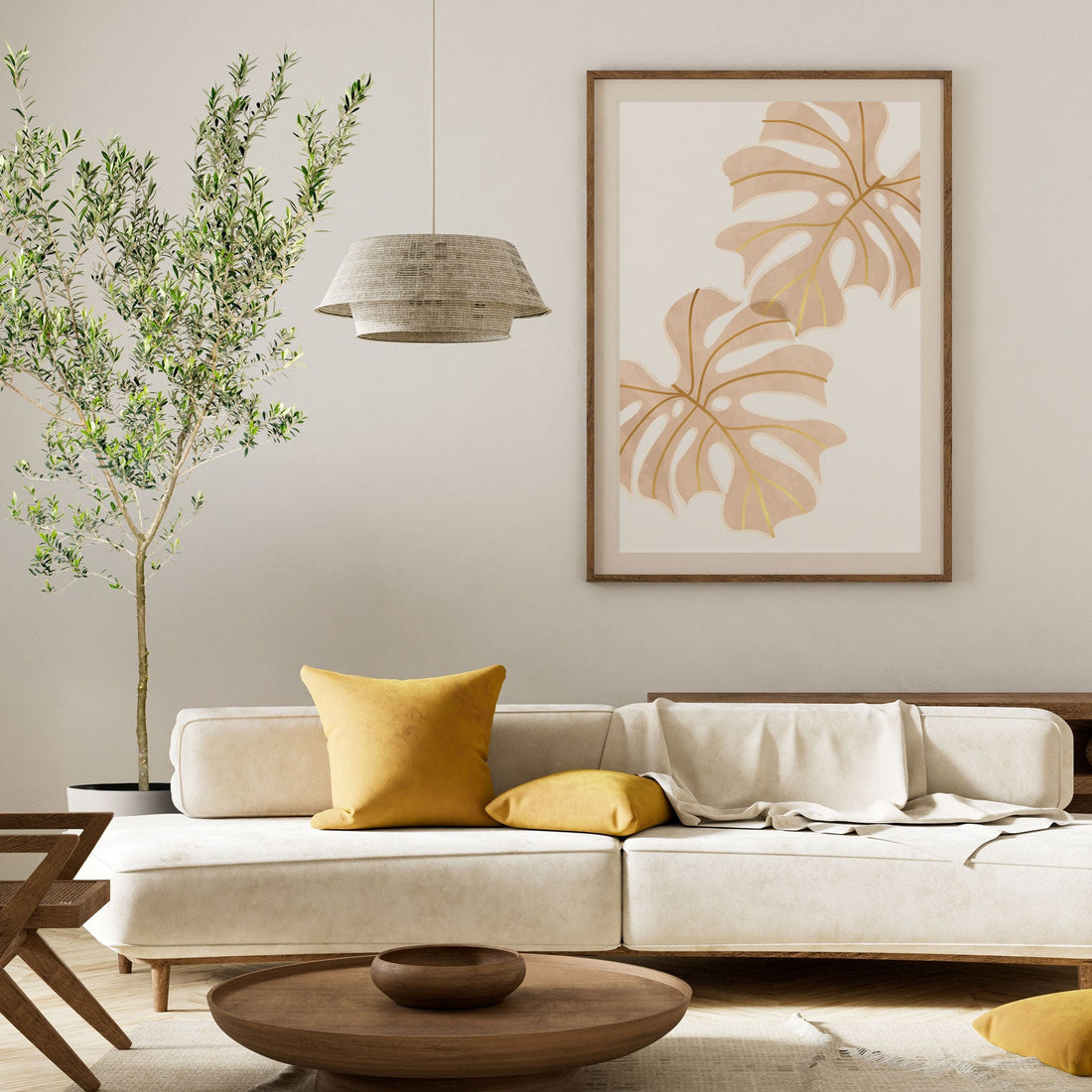 A potted Arbequina Olive Tree (Olea europaea) with a slender trunk and a full, lush canopy of small, silvery-green leaves, styled in a warm, modern living room with a beige sofa